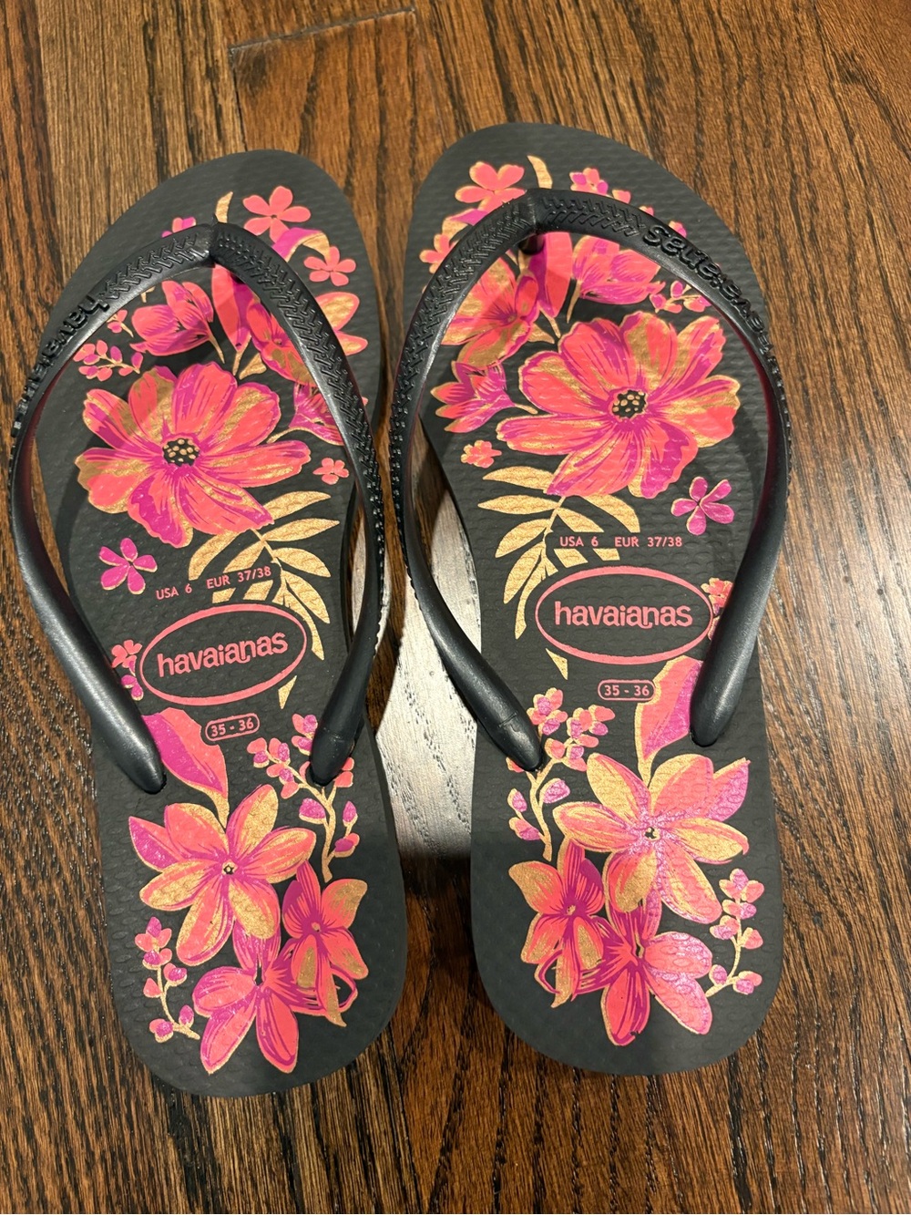 Havaianas Black Flip Flops with Pink and Gold Floral Pattern
